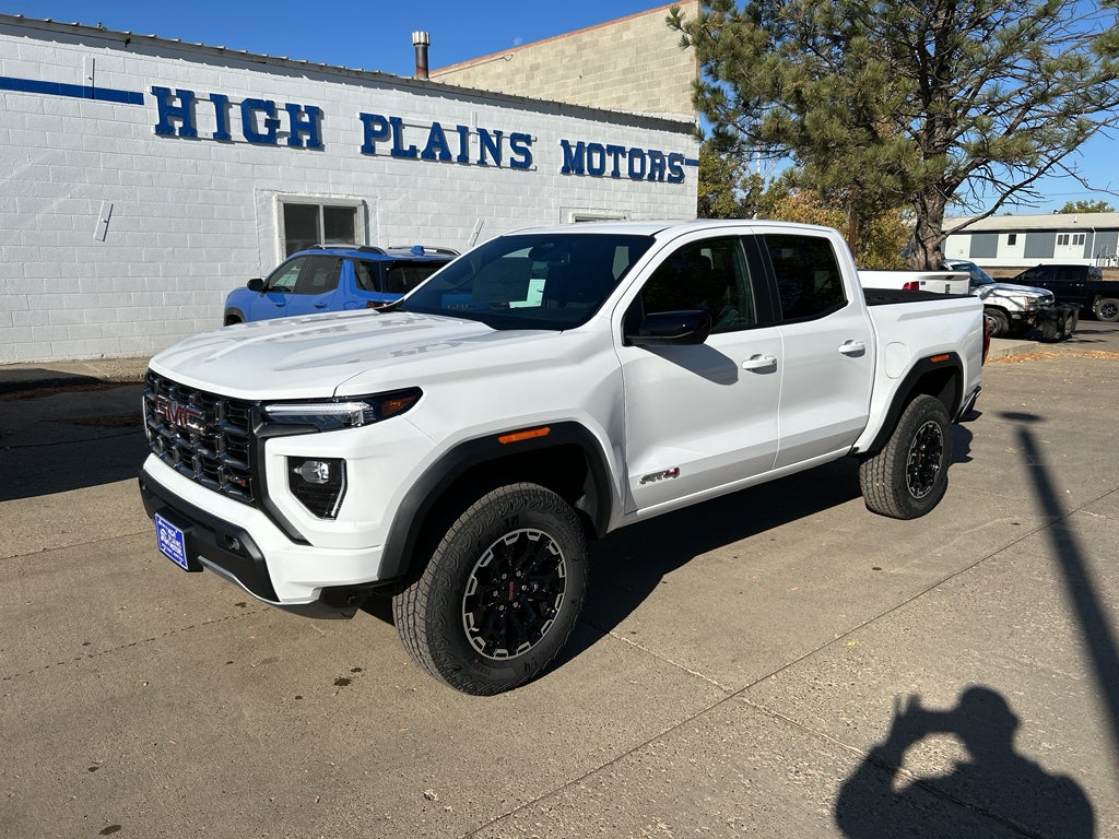 2026 GMC Canyon AT4 in Summit White — front three-quarter view
