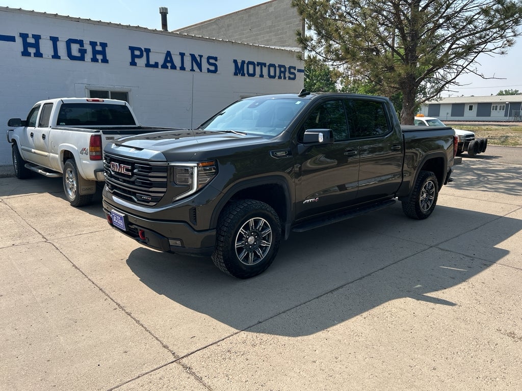 2024 GMC Sierra 1500 AT4 in Deep Bronze Metallic — front three-quarter view