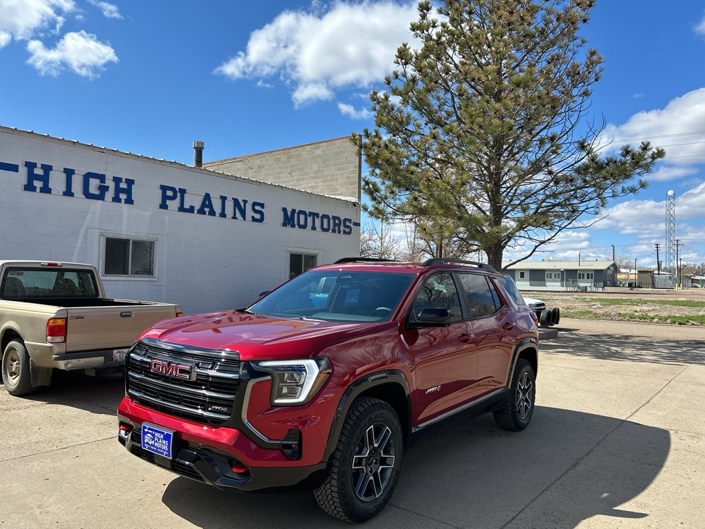 2026 GMC Terrain AT4 in Volcanic Red Tintcoat — front three-quarter view
